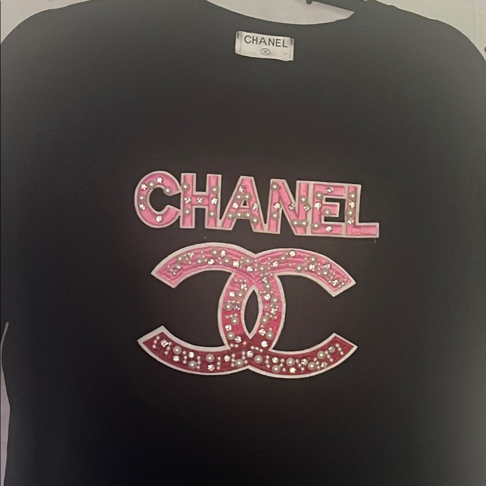 CHANEL Black Top with Pink Embellished Logo